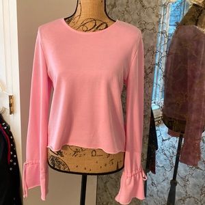 Active top with flare wrist. Like new size small.